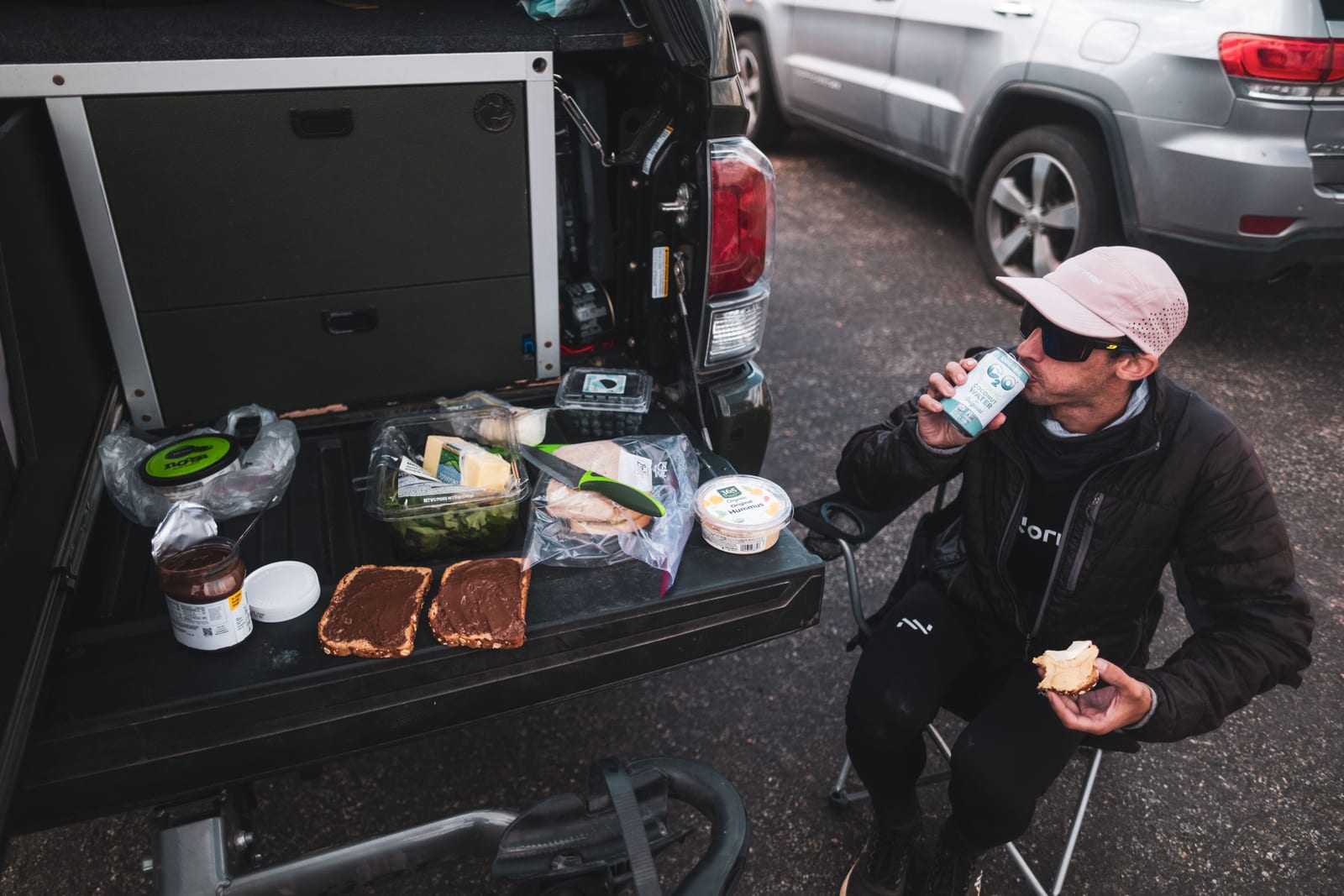 The support van between ranges: gear laid out, a meal, a few minutes off the feet.