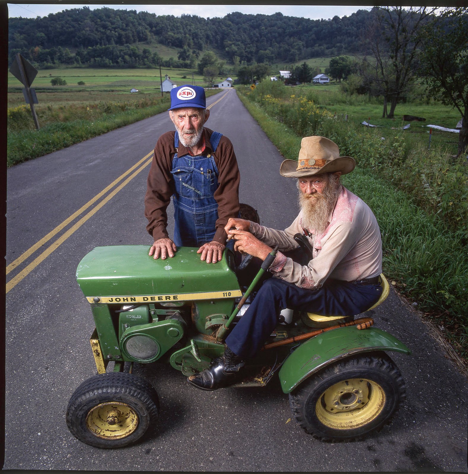 Alvin Straight and his brother Henry with the John Deere 110. Photograph by James Schnepf.